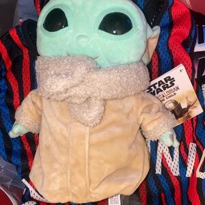 The Star Wars The Child Plush Toy is an 8-inch plush toy inspired by the Disney+